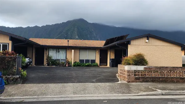 a front view of a house with garage