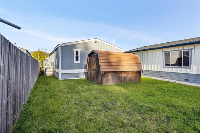a front view of house with yard and seating area