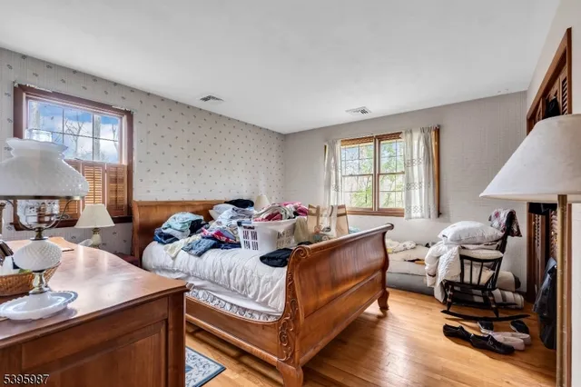 a bed room with furniture and a window