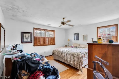 a bedroom with bed and a window