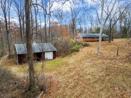 a wooden bench sitting in middle of forest