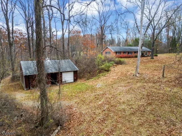 a wooden bench sitting in middle of forest