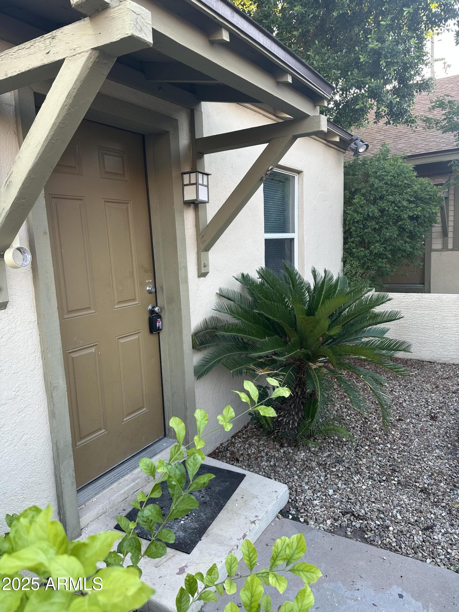 636 North 4th Avenue, Unit 3 Phoenix, AZ 85003 - Photo 1 of 8 a view of a house with a yard