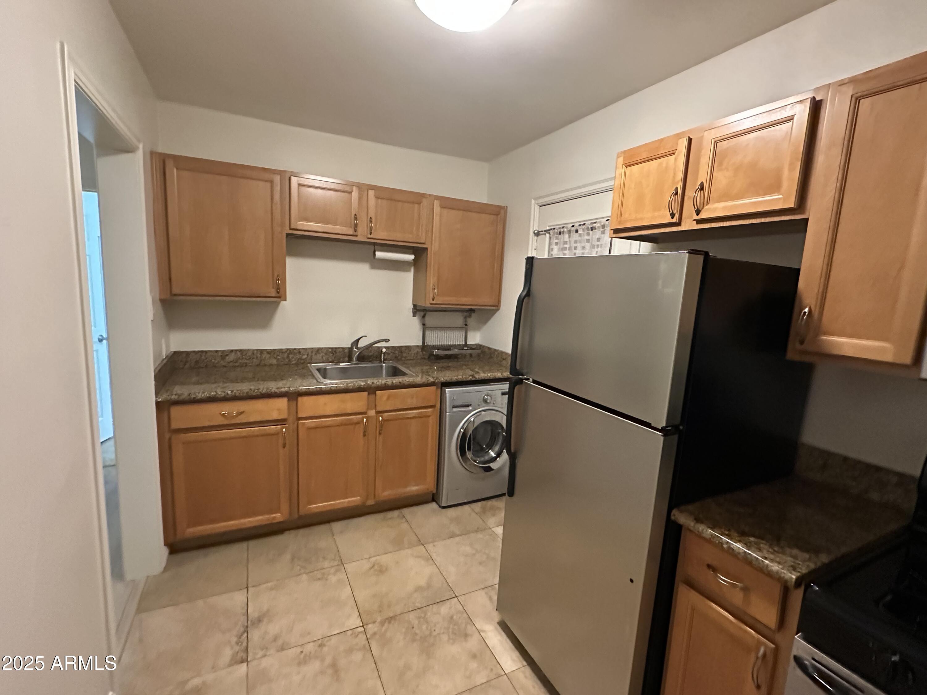 636 North 4th Avenue, Unit 3 Phoenix, AZ 85003 - Photo 7 of 8 a kitchen with a refrigerator and a stove