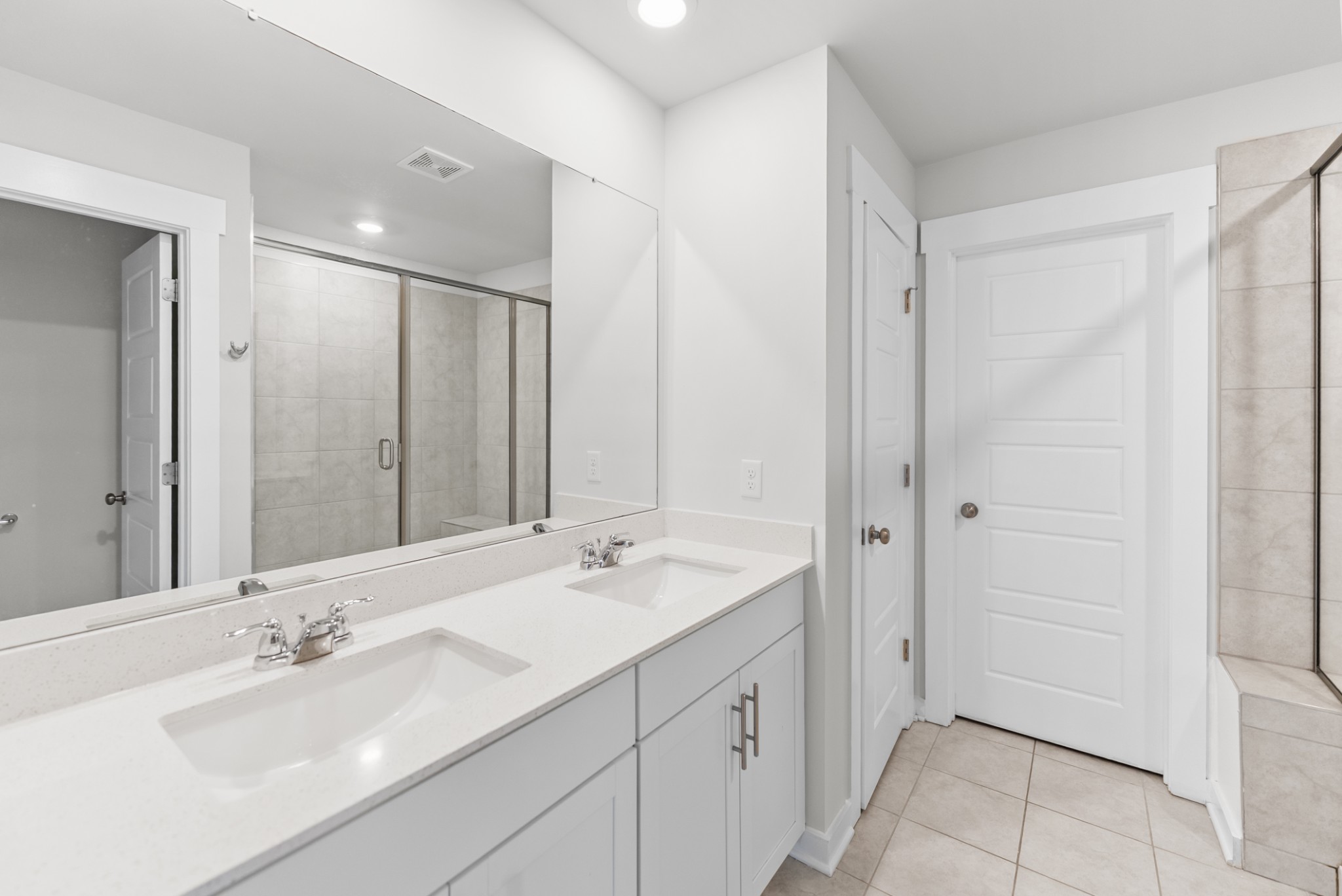 1255 Inverness Pass Lebanon, TN 37087 - Photo 27 of 40 a bathroom with a double vanity sink mirror and double