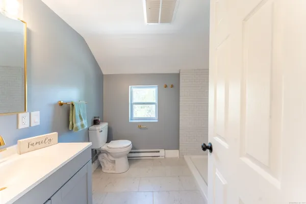 a bathroom with a sink a toilet and a bathtub