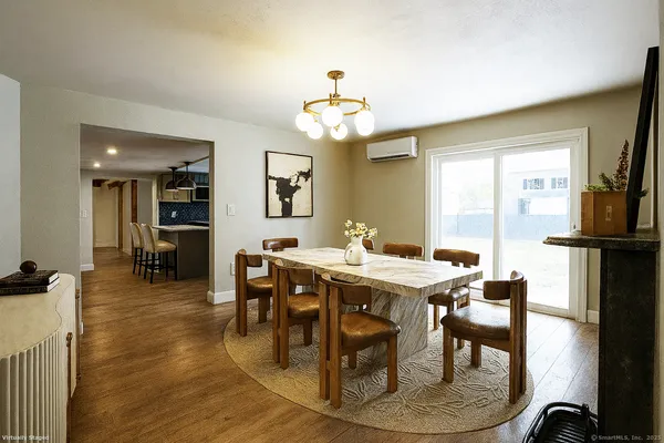a view of a dining room with furniture window and outside view