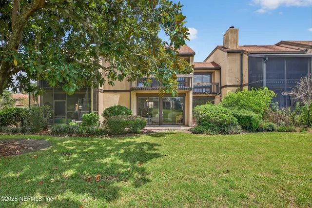 a big yard with lots of green space and palm trees
