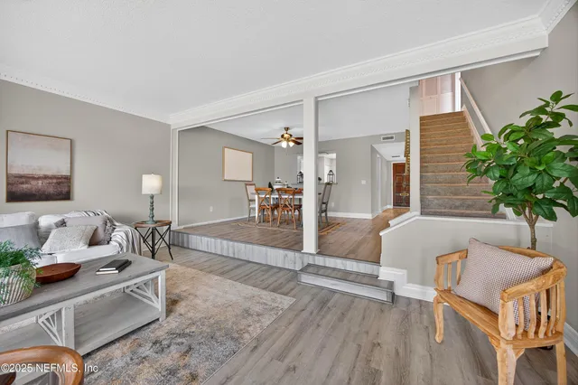 a living room with furniture and a table