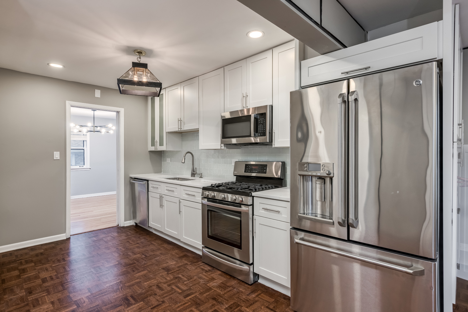 9539 Lorel Avenue Skokie, IL 60077 - Photo 12 of 38 a kitchen with stainless steel appliances a refrigerator sink and microwave