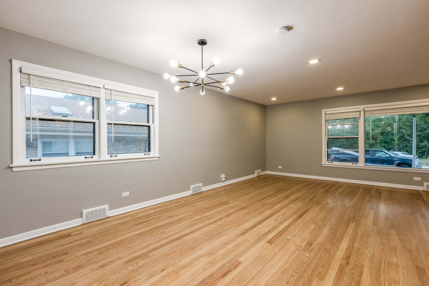 9539 Lorel Avenue Skokie, IL 60077 - Photo 5 of 38 a view of an empty room with wooden floor and a window