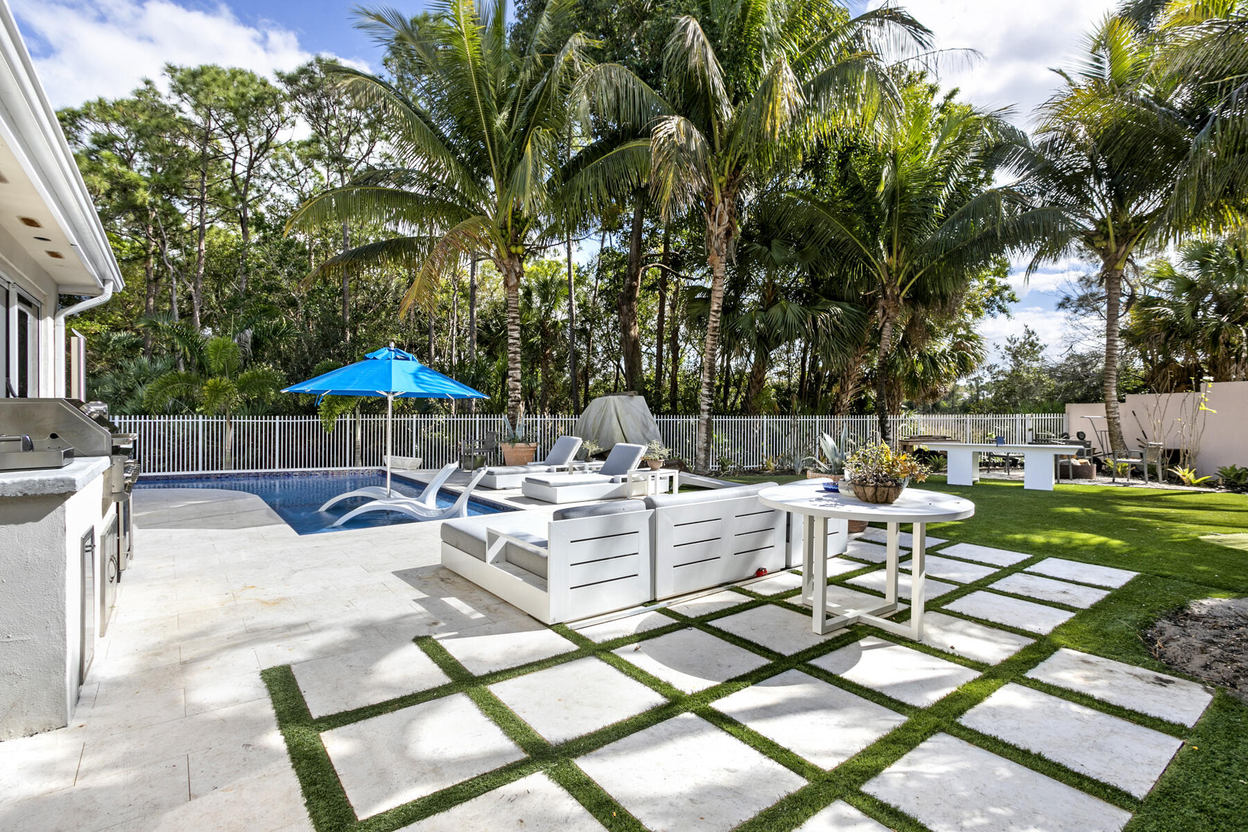 5226 Southeast Inkwood Way Hobe Sound, FL 33455 - Photo 21 of 30 a view of a patio with chairs and tables