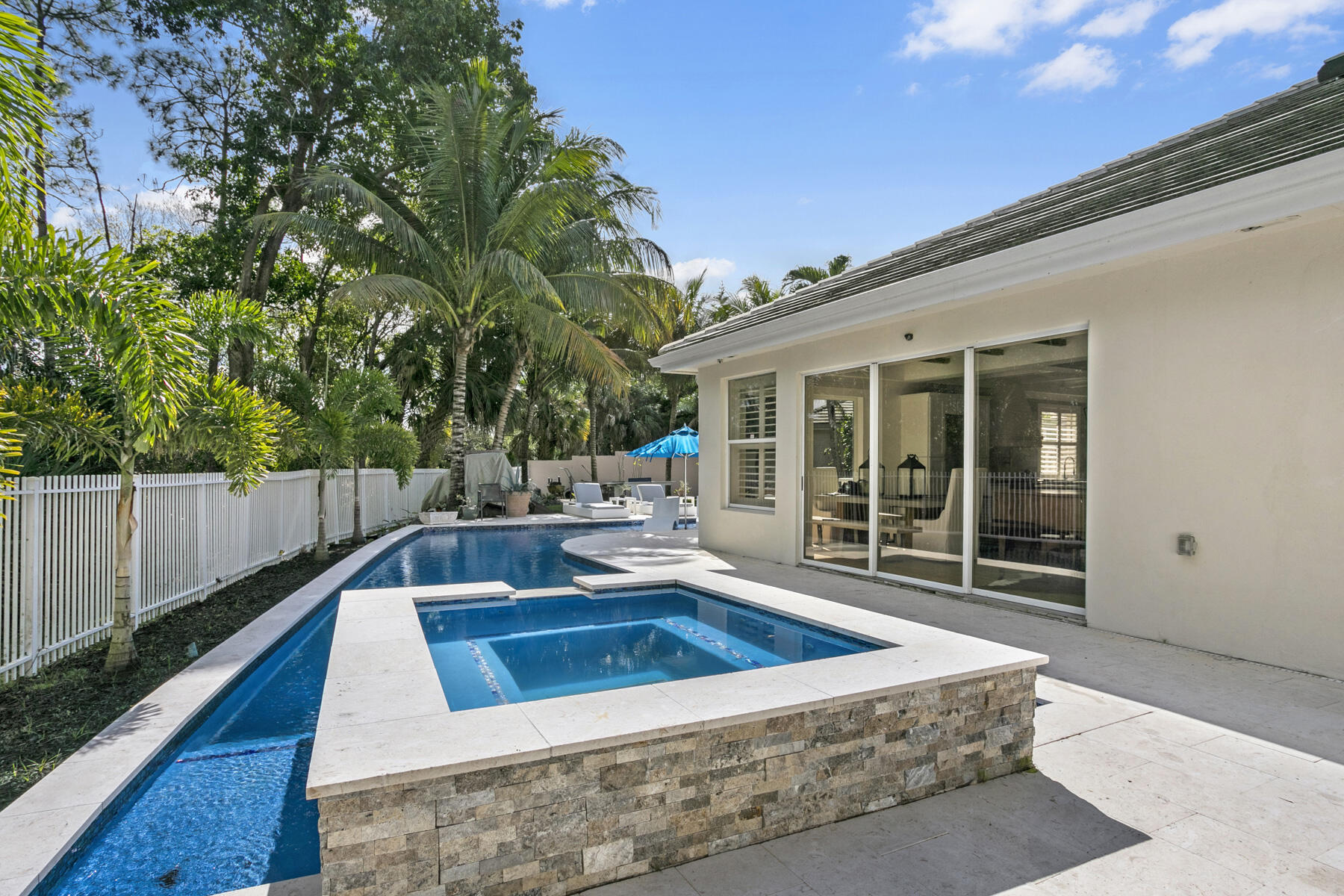5226 Southeast Inkwood Way Hobe Sound, FL 33455 - Photo 27 of 30 a view of a house with swimming pool in front of it