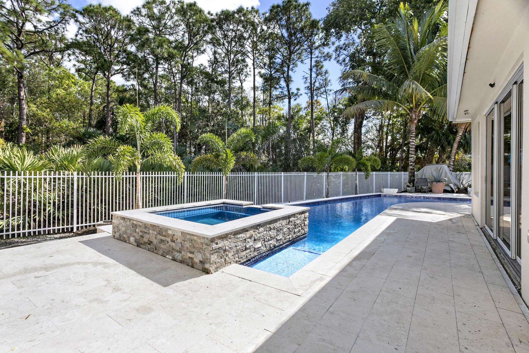 5226 Southeast Inkwood Way Hobe Sound, FL 33455 - Photo 28 of 30 a view of a backyard with a bench