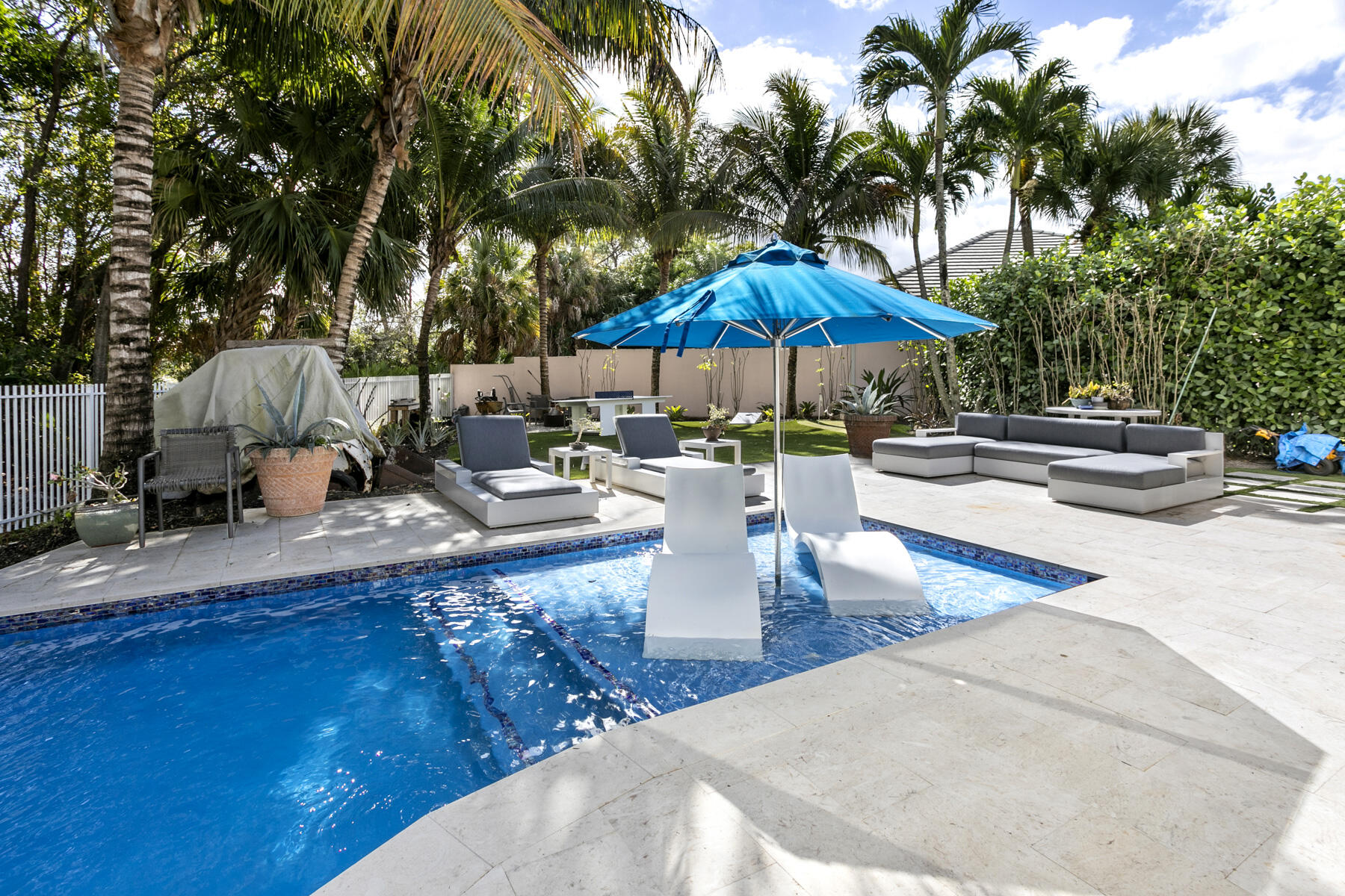 5226 Southeast Inkwood Way Hobe Sound, FL 33455 - Photo 29 of 30 a view of a patio with swimming pool table and chairs