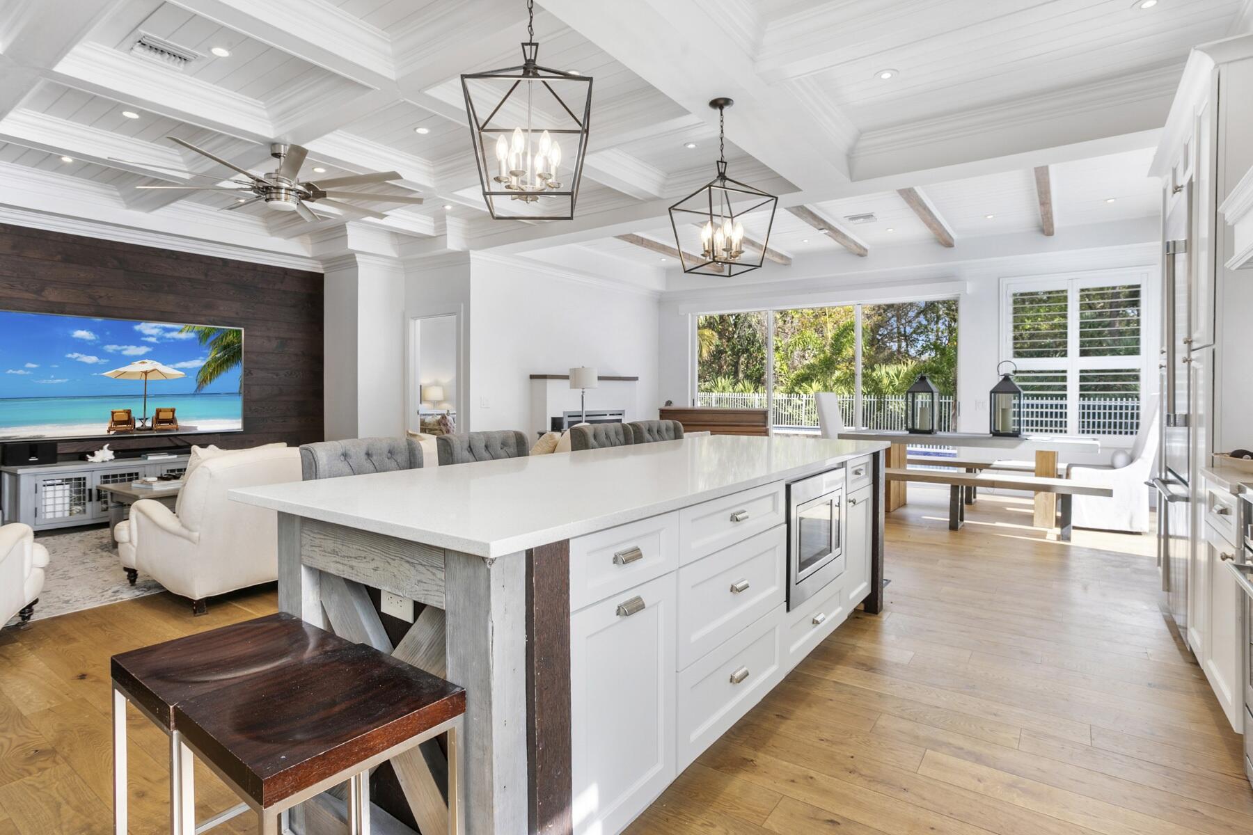 5226 Southeast Inkwood Way Hobe Sound, FL 33455 - Photo 6 of 30 a large kitchen with a table and chairs