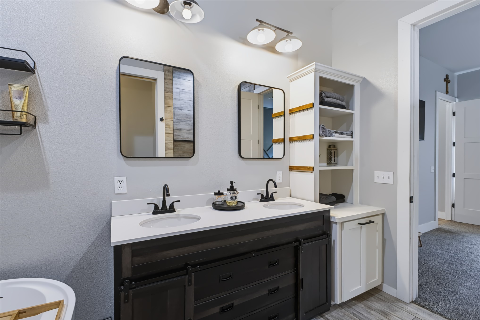 3607 South Half Bank Road Atoka, OK 74525 - Photo 23 of 82 Dual vanity featuring white countertops, matte black faucets, and rectangular mirrors