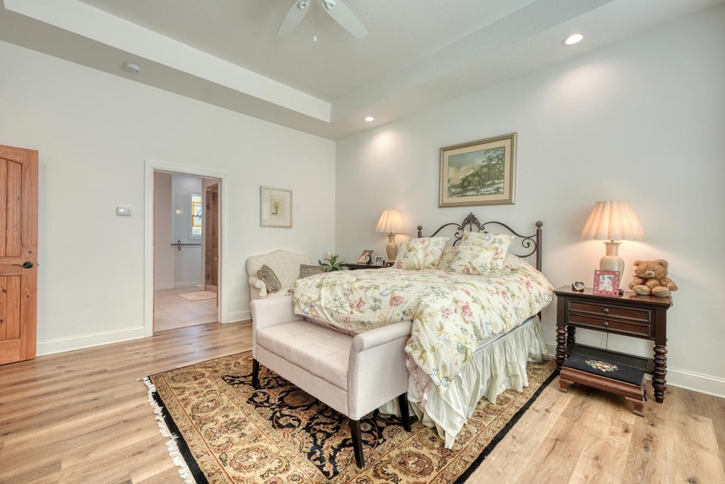 1735 Downings Creek Road Hayesville, NC 28904 - Photo 18 of 42 a bedroom with a bed and wooden floor