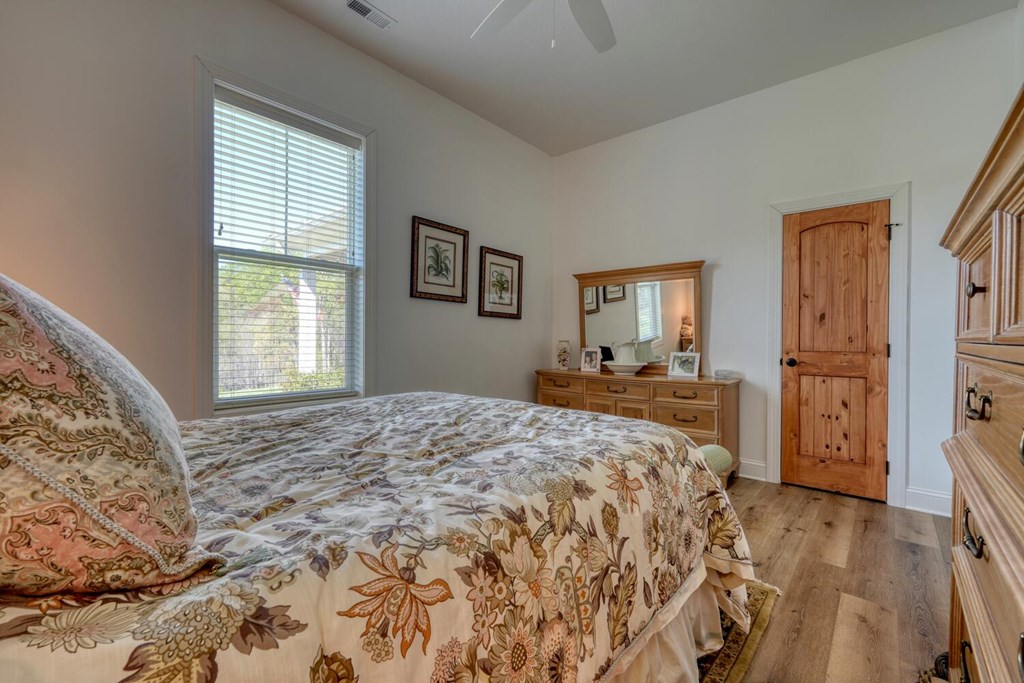 1735 Downings Creek Road Hayesville, NC 28904 - Photo 23 of 42 a bedroom with a large bed and a window