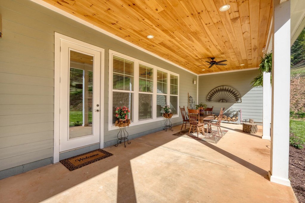 1735 Downings Creek Road Hayesville, NC 28904 - Photo 24 of 42 a view of a room with window and chairs