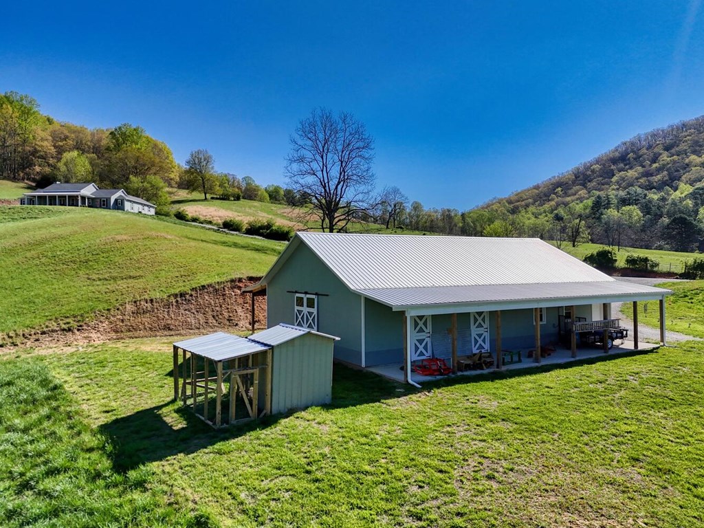 1735 Downings Creek Road Hayesville, NC 28904 - Photo 42 of 42 a view of a house with a yard
