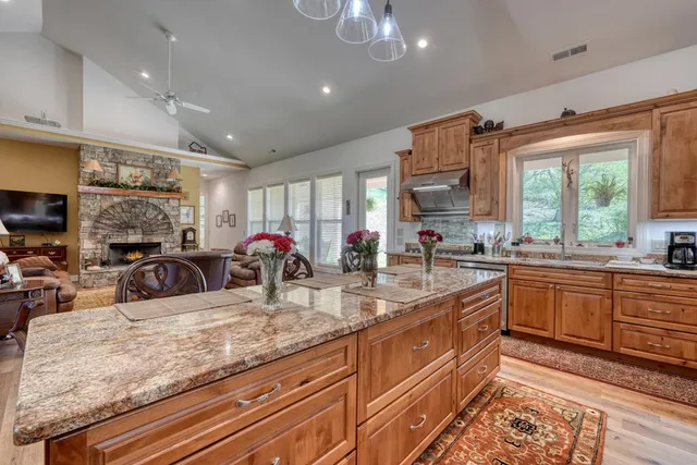 a kitchen with lots of counter top space and living room