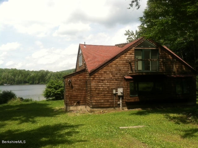 84 Windsor Pond Road Windsor, MA 01270 - Photo 1 of 46 a view of a house with a yard