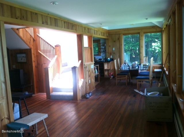 84 Windsor Pond Road Windsor, MA 01270 - Photo 12 of 46 a living room with furniture and a large window