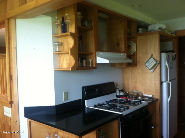 84 Windsor Pond Road Windsor, MA 01270 - Photo 3 of 46 a kitchen with stainless steel appliances granite countertop a sink stove and refrigerator
