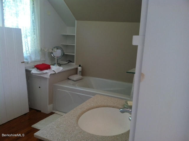 84 Windsor Pond Road Windsor, MA 01270 - Photo 28 of 46 a bathroom with a sink toilet and vanity