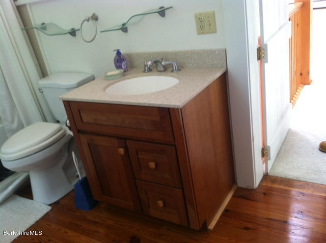 84 Windsor Pond Road Windsor, MA 01270 - Photo 30 of 46 a bathroom with a sink toilet and vanity