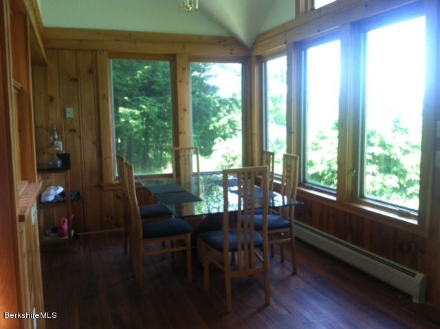 84 Windsor Pond Road Windsor, MA 01270 - Photo 4 of 46 a view of a dining room with furniture window and wooden floor