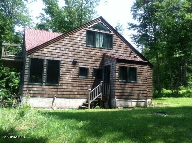 84 Windsor Pond Road Windsor, MA 01270 - Photo 36 of 46 a front view of a house with a yard