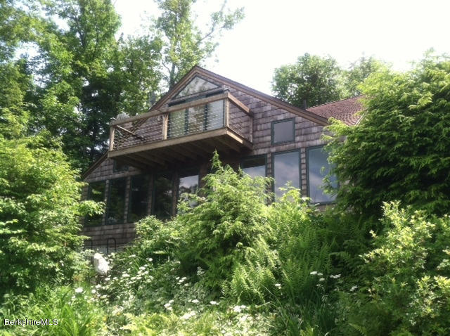84 Windsor Pond Road Windsor, MA 01270 - Photo 37 of 46 a house that has a tree in it