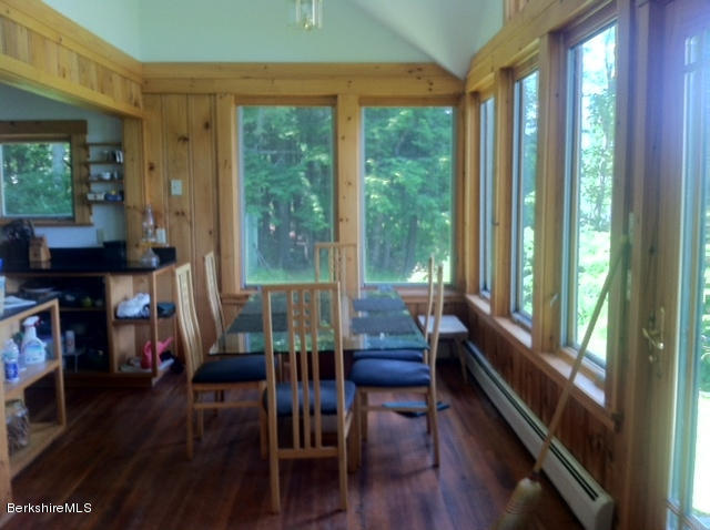 84 Windsor Pond Road Windsor, MA 01270 - Photo 5 of 46 a view of a dining room with furniture and wooden floor