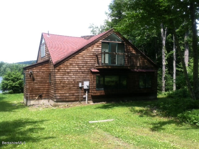 84 Windsor Pond Road Windsor, MA 01270 - Photo 41 of 46 a front view of a house with a yard
