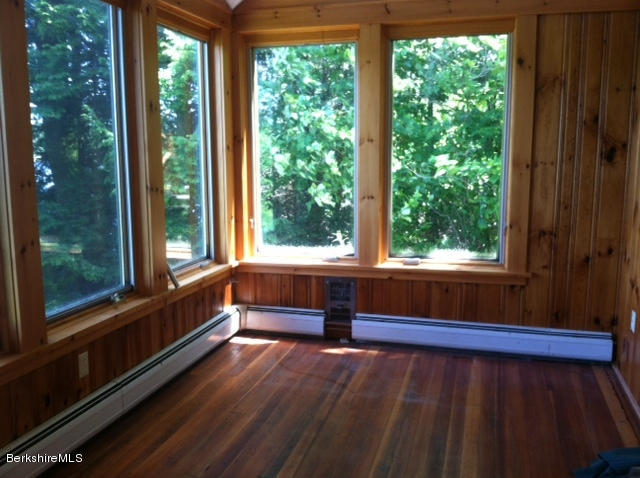 84 Windsor Pond Road Windsor, MA 01270 - Photo 9 of 46 a view of a balcony with wooden floor and outdoor space