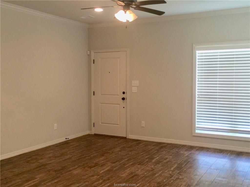109 Ehlinger Drive Bryan, TX 77801 - Photo 24 of 25 a view of an empty room with wooden floor and a window