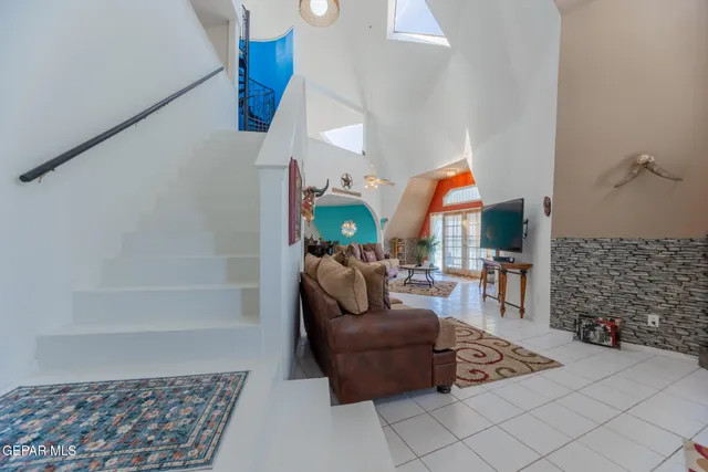 a living room with furniture and a rug