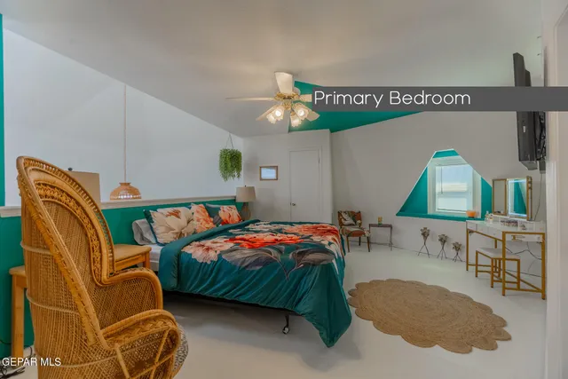 a bedroom with a bed and a couch