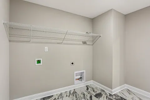 a view of a bedroom with baby bed