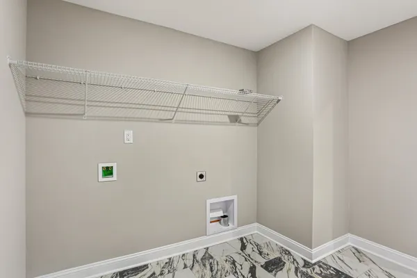 a view of a bedroom with baby bed