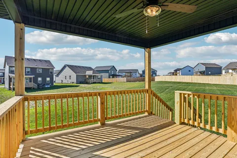 a view of balcony with wooden floor