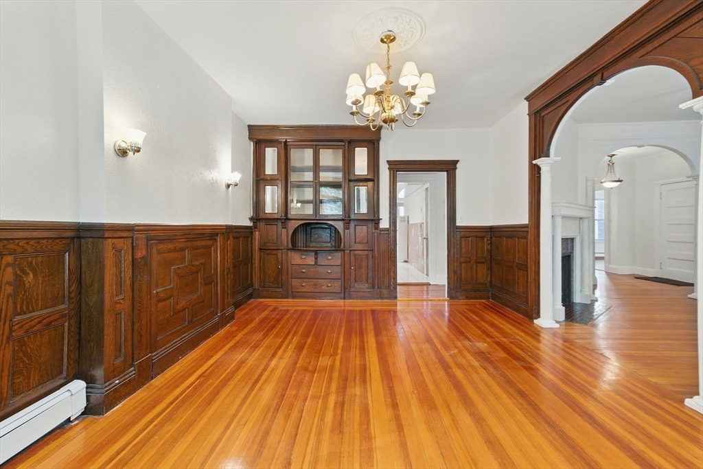 17 Strathmore Road, Unit 2 Brookline, MA 02445 - Photo 13 of 32 a view of a room with wooden floor and staircase