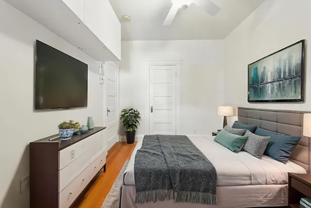 a view of room with hardwood floor and window