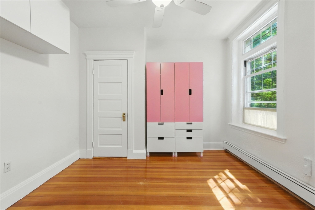 17 Strathmore Road, Unit 2 Brookline, MA 02445 - Photo 25 of 32 a view of room with hardwood floor and window