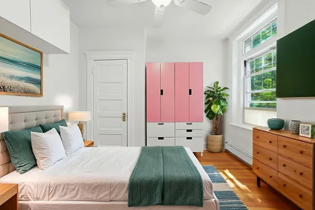 a bathroom with a granite countertop bathtub shower sink vanity and toilet
