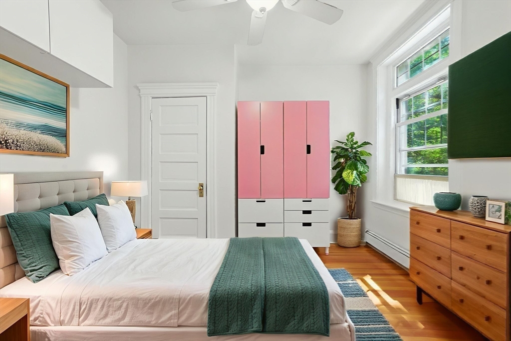 17 Strathmore Road, Unit 2 Brookline, MA 02445 - Photo 27 of 32 a bedroom with a bed and a window