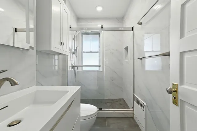 a view of a hallway with washer and dryer