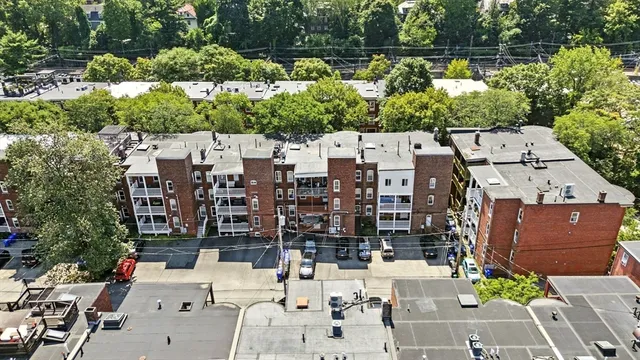 front view of a brick house with a yard